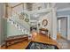 Inviting foyer with hardwood floors, staircase, and stylish décor, creating a warm and welcoming atmosphere at 10703 Back Ridge Rd, Charlotte, NC 28277