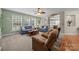 Bright living room boasts ample natural light and views to the kitchen and entry way at 10703 Back Ridge Rd, Charlotte, NC 28277