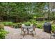 Private patio with a seating area and garden, perfect for outdoor enjoyment at 10703 Back Ridge Rd, Charlotte, NC 28277