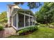 Enclosed screened-in porch, perfect for outdoor dining and entertaining at 10703 Back Ridge Rd, Charlotte, NC 28277