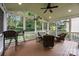 Inviting screened porch with comfortable seating and views of the backyard at 10703 Back Ridge Rd, Charlotte, NC 28277