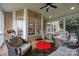 Screened-in porch with comfortable seating and a view of the outdoors at 10703 Back Ridge Rd, Charlotte, NC 28277