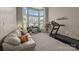 Bright sitting room with bay windows, neutral carpet, and a treadmill, offering a flexible space for relaxation at 10703 Back Ridge Rd, Charlotte, NC 28277