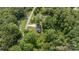 Aerial view of home nestled in a lush green landscape and wooded area at 119 Wade Dr, Kings Mountain, NC 28086