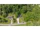 Aerial view of home nestled in a lush green landscape and wooded area at 119 Wade Dr, Kings Mountain, NC 28086