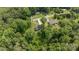 Aerial view of home nestled in a lush green landscape and wooded area at 119 Wade Dr, Kings Mountain, NC 28086