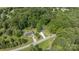 Aerial view of home nestled in a lush green landscape and wooded area at 119 Wade Dr, Kings Mountain, NC 28086