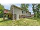 Backyard view of a house with a wooden deck and brick foundation at 119 Wade Dr, Kings Mountain, NC 28086