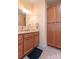 Bathroom featuring wood cabinets, countertops, tiled floors, and storage cabinets at 119 Wade Dr, Kings Mountain, NC 28086