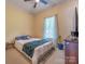 Bedroom with a large window, hardwood floors, and ceiling fan at 119 Wade Dr, Kings Mountain, NC 28086