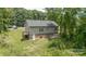 Aerial view of a house with a deck and green surrounding landscape at 119 Wade Dr, Kings Mountain, NC 28086