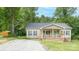 Charming single-story home with a inviting front porch and manicured lawn at 119 Wade Dr, Kings Mountain, NC 28086