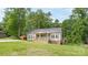 Charming single-story home with a inviting front porch and lush green lawn at 119 Wade Dr, Kings Mountain, NC 28086