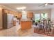 Kitchen with stainless steel appliances, island, and eat-in area with many plants and natural light at 119 Wade Dr, Kings Mountain, NC 28086