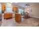 Open concept kitchen with an island and eat in area with a view to the backyard at 119 Wade Dr, Kings Mountain, NC 28086