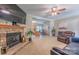 The living room features a brick fireplace with a view to the kitchen at 119 Wade Dr, Kings Mountain, NC 28086