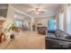 Spacious living room features a fireplace, ceiling fan, and view to the breakfast area at 119 Wade Dr, Kings Mountain, NC 28086