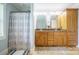 Bright bathroom with double vanity, granite countertop, and tiled flooring, accented by stylish shower curtain at 121 Jefferson Dr, Locust, NC 28097