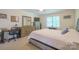 Comfortable bedroom with carpeted floors and a well-lit workspace at 121 Jefferson Dr, Locust, NC 28097