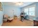 Bright bedroom features soft blue walls, plush chair, desk and carpet flooring at 121 Jefferson Dr, Locust, NC 28097