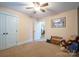 Neutral bedroom with carpet flooring, light walls and ceilings, with a closet at 121 Jefferson Dr, Locust, NC 28097