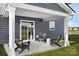Relaxing back porch featuring chairs, great for outdoor seating and enjoyment at 12109 Beaux Art Ln, Charlotte, NC 28214