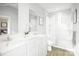 Bright bathroom with dual sinks, a large mirror, and a glass-enclosed shower at 12109 Beaux Art Ln, Charlotte, NC 28214