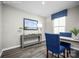 Stylish dining room showcasing a gray console table, blue accents and modern decor with sleek flooring at 12109 Beaux Art Ln, Charlotte, NC 28214