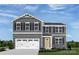 Charming two-story home featuring gray siding, a white garage door, and a well-maintained front yard at 12109 Beaux Art Ln, Charlotte, NC 28214