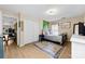 Bedroom featuring a metal frame bed, a patterned rug, and a view of the hallway and doorway at 122 Pratt St, Belmont, NC 28012