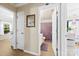 Hallway featuring a doorway leading to a bathroom with a purple shower curtain at 122 Pratt St, Belmont, NC 28012
