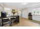 Bright eat-in kitchen featuring modern appliances, light wood floors, and a functional space perfect for Gathering meals and entertaining at 122 Pratt St, Belmont, NC 28012