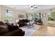 Comfortable living room offering two couches, a glass coffee table, and a view of the outdoors with hardwood-style flooring at 122 Pratt St, Belmont, NC 28012