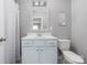 Clean bathroom with modern vanity, and framed mirror at 12220 Huntersville Concord Rd, Huntersville, NC 28078