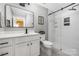 Modern bathroom with walk-in shower, stylish vanity and contemporary finishes at 12220 Huntersville Concord Rd, Huntersville, NC 28078