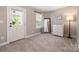 Cozy bedroom featuring access to backyard, a ceiling fan, and neutral decor at 12220 Huntersville Concord Rd, Huntersville, NC 28078