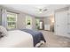 Cozy bedroom with ample natural light, a ceiling fan, and neutral decor at 12220 Huntersville Concord Rd, Huntersville, NC 28078