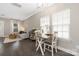 Bright dining area with natural light, crown molding, and a comfortable seating area in the background at 12220 Huntersville Concord Rd, Huntersville, NC 28078