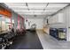 Garage space equipped with a home gym setup and storage cabinets at 12220 Huntersville Concord Rd, Huntersville, NC 28078