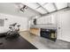 Spacious garage featuring a fitness area, built-in cabinets, and ample storage solutions at 12220 Huntersville Concord Rd, Huntersville, NC 28078
