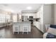 Modern kitchen with white cabinets, granite countertops, stainless steel appliances, and an island with bar seating at 12220 Huntersville Concord Rd, Huntersville, NC 28078