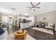 Bright living area features a kitchen, stainless appliances, an island with seating, and an inviting seating area at 12220 Huntersville Concord Rd, Huntersville, NC 28078