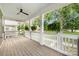 Relaxing porch features a ceiling fan and decorative plants with a lovely neighborhood view at 12220 Huntersville Concord Rd, Huntersville, NC 28078