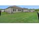 Well-maintained backyard features a lush lawn and black metal fencing, providing a secure outdoor space at 1344 Sweet Pea St, Monroe, NC 28110