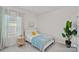 Cozy bedroom featuring a comfortable single bed, a stylish side table, and a bright window at 1344 Sweet Pea St, Monroe, NC 28110