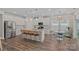 Bright kitchen boasts stainless steel appliances, large island with seating, and an adjacent breakfast nook at 1344 Sweet Pea St, Monroe, NC 28110