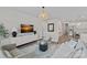 Open concept living room with stylish furnishings, large windows, and a modern aesthetic at 1344 Sweet Pea St, Monroe, NC 28110