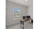 Home office with large window for natural light, neutral walls and carpet at 1344 Sweet Pea St, Monroe, NC 28110