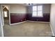 Bright bedroom boasts neutral carpet and a window with a decorative border at 140 Hunters Hill Dr, Statesville, NC 28677