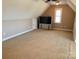 Spacious bonus room with plush carpet, ceiling fan, and a mounted television at 140 Hunters Hill Dr, Statesville, NC 28677